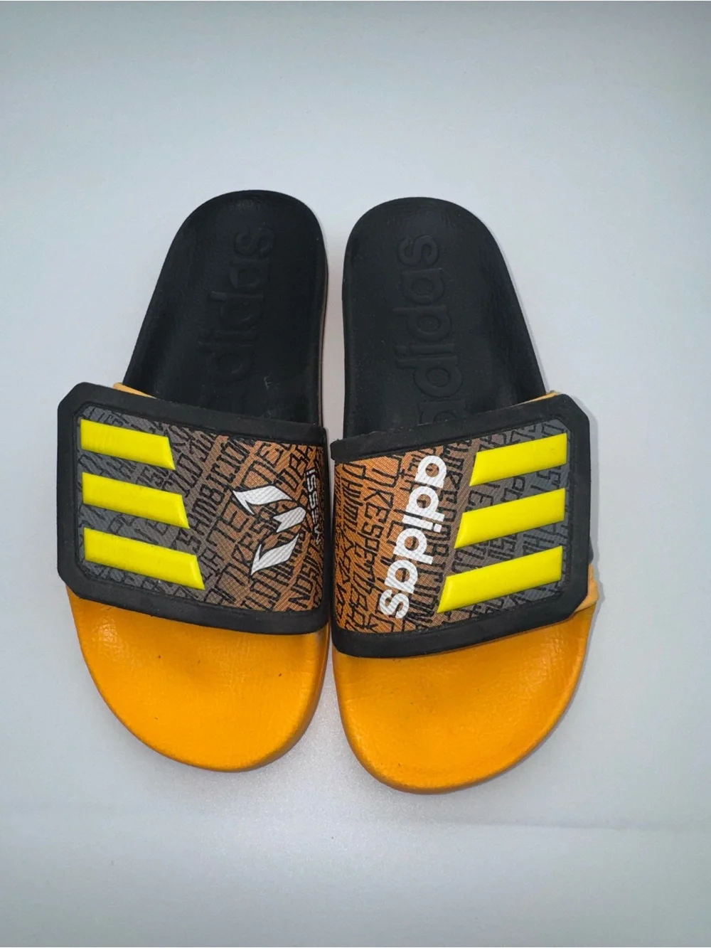 adidas Kids Orange and Black Slide Sandals with Neon Yellow Accents